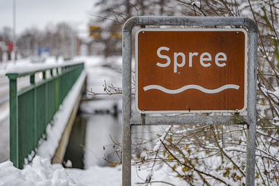 Close-up of sign on snow