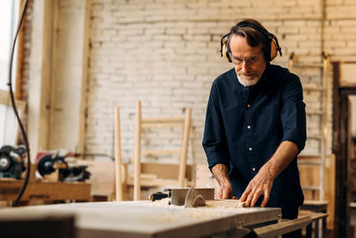 Man working on wood