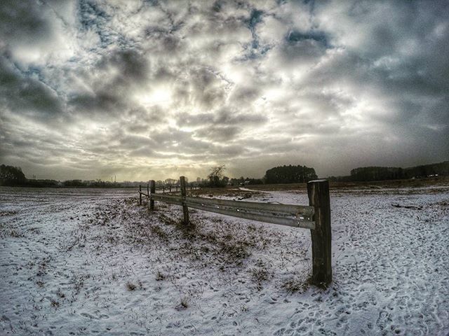 sky, cloud - sky, cloudy, weather, tranquility, tranquil scene, water, nature, cloud, scenics, overcast, landscape, beauty in nature, snow, winter, fence, wood - material, field, cold temperature, pier