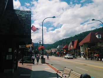 City street against cloudy sky