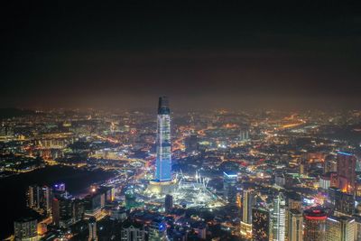 High angle view of illuminated city buildings at night