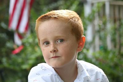 Portrait of boy looking away outdoors