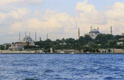 Hagia sophia and blue mosque against cloudy sky