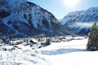 Scenic view of snow covered mountains against sky