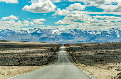 Road amidst landscape against sky