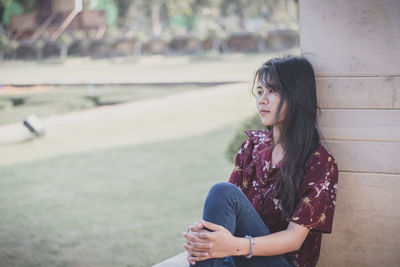 Side view of a young woman looking away