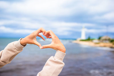 Cropped hand of woman holding hands