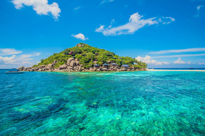 Scenic view of sea against blue sky