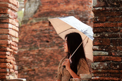 A girl with an umbrella on a sunny day