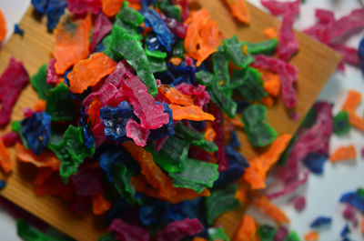 High angle view of multi colored candies on table