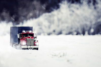 Vintage car on snow covered land
