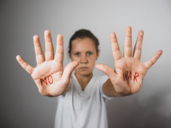 Stop the war,message of peace without war is written on the hands of a child there is no war, 