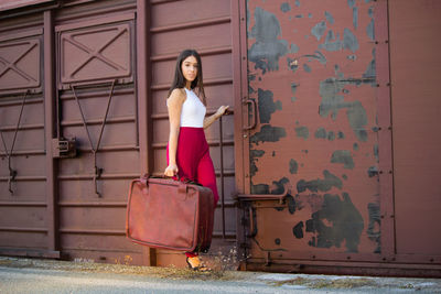 Woman standing by door