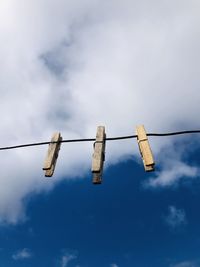 Low angle view of electricity pylon against sky
