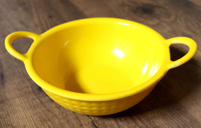 Close-up of yellow bowl on table