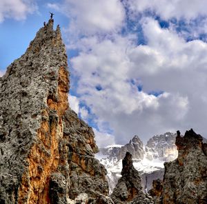 Low angle view of rock formations against sky