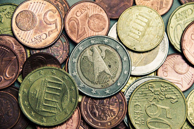 High angle view of coins on table