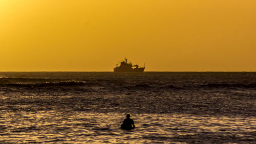 Scenic view of sea at sunset