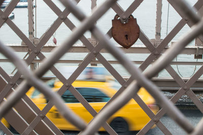 Close-up of chainlink fence against sky