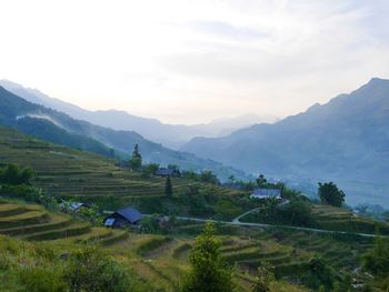 Scenic view of landscape and mountains against sky