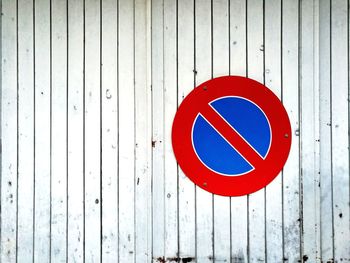 Do not park. swiss road sign on wooden garage door.