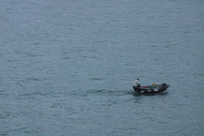 High angle view of people on boat sailing in sea