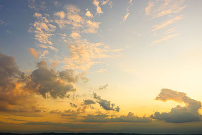 Low angle view of dramatic sky during sunset