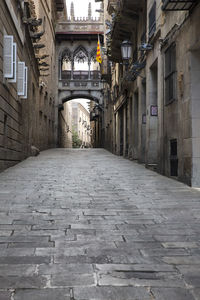 Empty alley amidst buildings