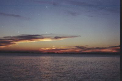 Scenic view of sea against sky at sunset