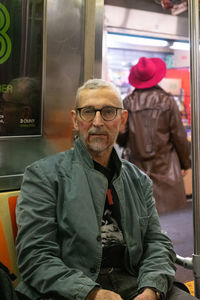 Portrait of senior man sitting in bus