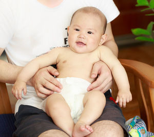 Portrait of cute baby girl sitting