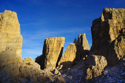 Low angle view of rock formation against sky