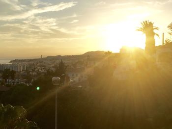 Panoramic view of city against sky during sunset