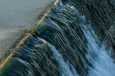 High angle view of water flowing over sea