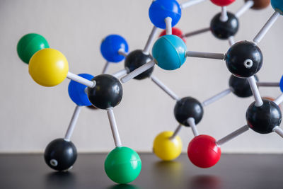 Close-up of colorful molecule models on table