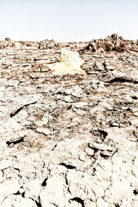 Scenic view of rocks on land against sky