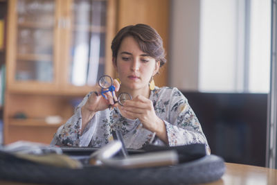 Upcycling young woman at home