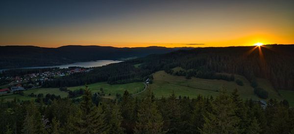 Scenic view of landscape against sky during sunset