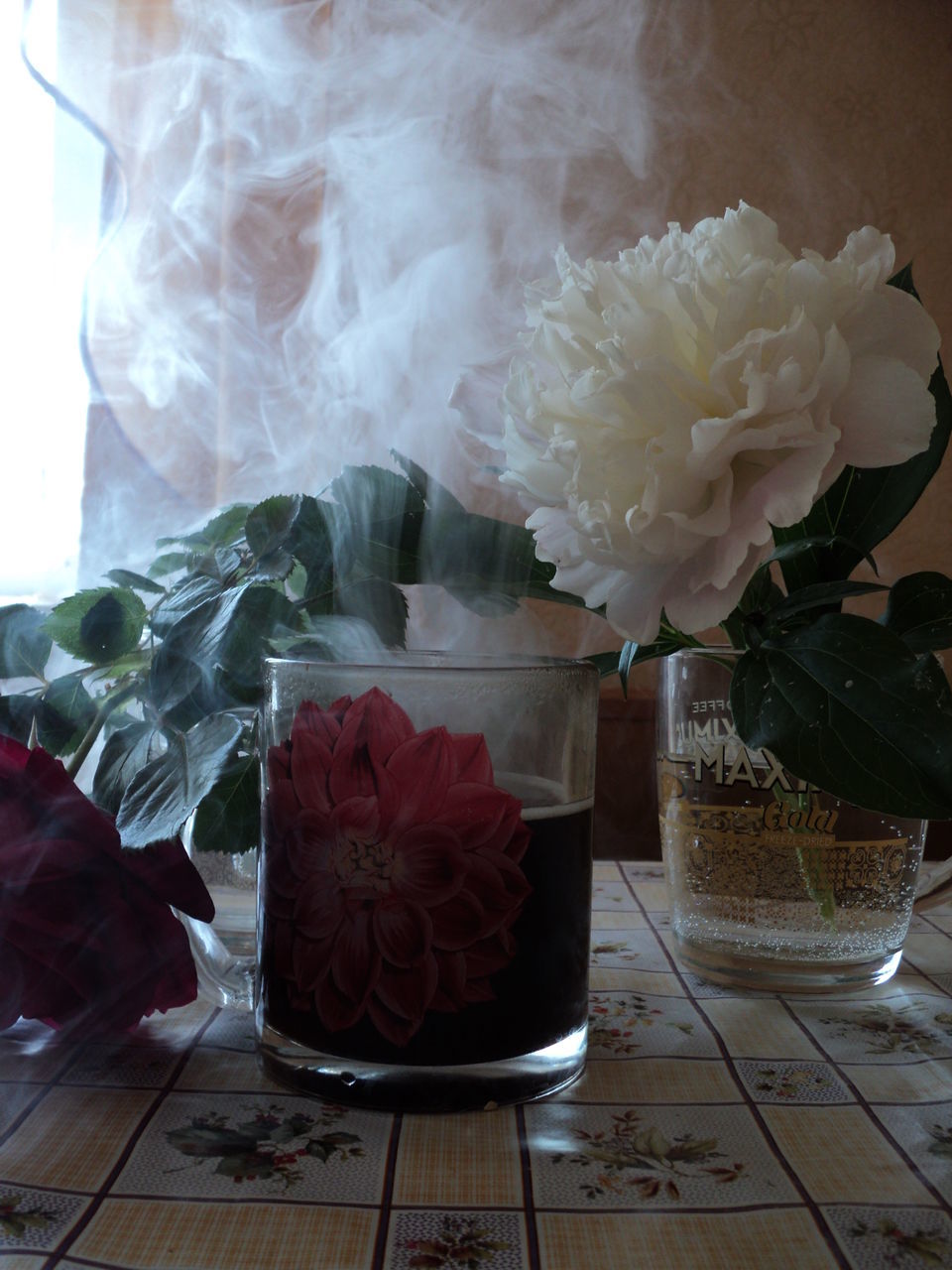 CLOSE-UP OF ROSES ON TABLE