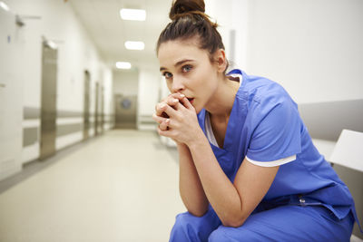 Sad doctor sitting in hospital