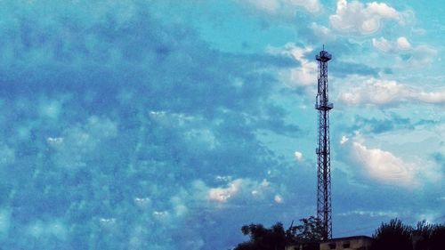 Low angle view of communications tower against sky