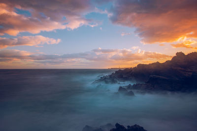 Scenic view of sea against sky during sunset