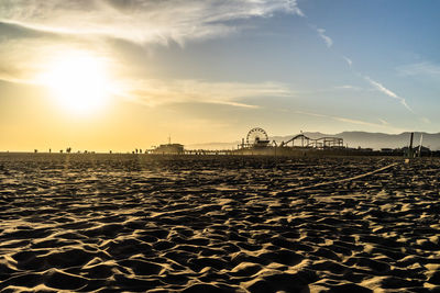 View of beach against sky during sunset