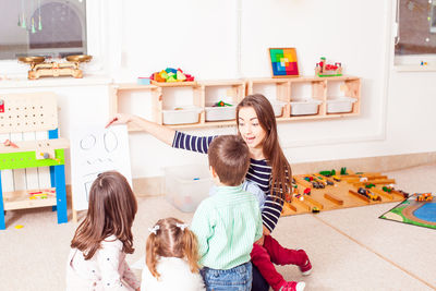Teacher teaching students in classroom