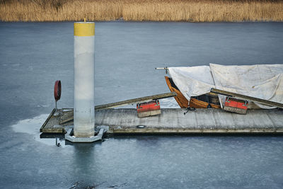 High angle view of nautical vessel on road by lake