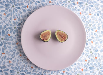 High angle view of figs in plate on table