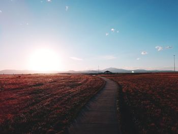 Scenic view of agricultural land against sky