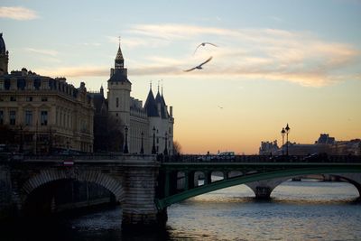 View of bridge over river in city