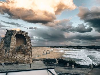 Panoramic view of sea and buildings against sky