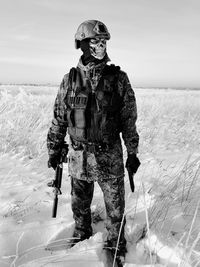 Full length of child standing on snow covered land